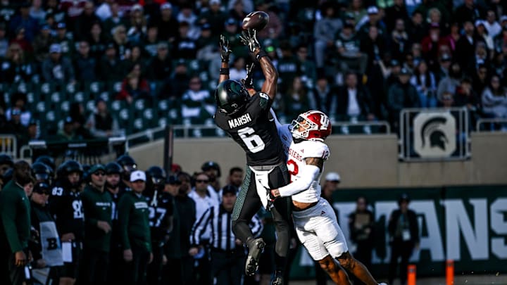 Michigan State's Nick Marsh, left, makes a catch as Indiana's Terry Jones Jr. defends during the first quarter on Saturday, Nov. 2, 2024, at Spartan Stadium in East Lansing.