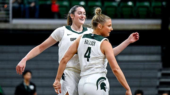 Michigan State's Grace VanSlooten, left, and Theryn Hallock celebrate a score against Wayne State during the first quarter on Monday, Oct. 28, 2024, in East Lansing.