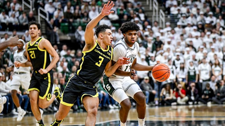 Michigan State's Jase Richardson, right, moves the ball as Oregon's Jackson Shelstad defends during the first half on Saturday, Feb. 8, 2025, at the Breslin Center East Lansing.