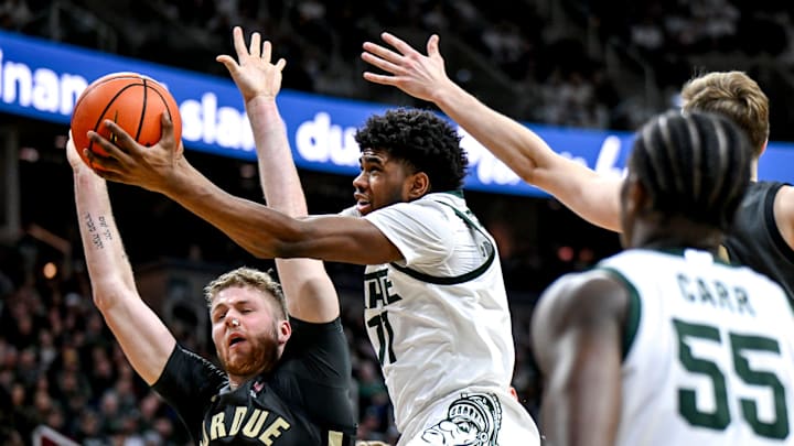 Michigan State's Jase Richardson shoots a layup against Purdue's Caleb Furst, left, during the first half on Tuesday, Feb. 18, 2025, at the Breslin Center in East Lansing.