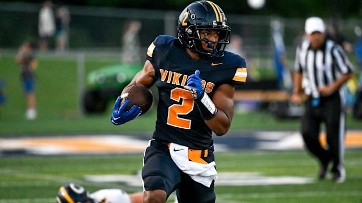 Haslett's Kory Amachree runs for a touchdown against DeWitt during the second quarter on Thursday, Aug. 29, 2024, at Haslett High School.
