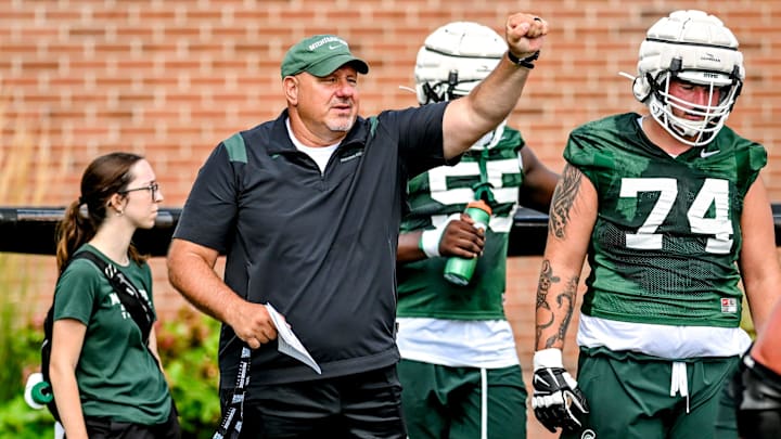 Michigan State's offensive line coach Jim Michalczik works with the team during the first day of football camp on Tuesday, July 30, 2024, in East Lansing.