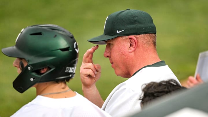 Michigan State's head coach Jake Boss Jr. signals to players during the sixth inning in the game against Ohio State on Friday, April 18, 2025, at McLane Stadium in East Lansing.