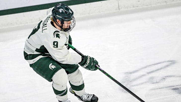 Michigan State's Matt Basgall moves the puck against Minnesota during the first period on Saturday, Jan. 25, 2025, at Munn Arena in East Lansing. Michigan State's Matt Basgall moves the puck against Minnesota during the first period on Saturday, Jan. 25, 2025, at Munn Arena in East Lansing.