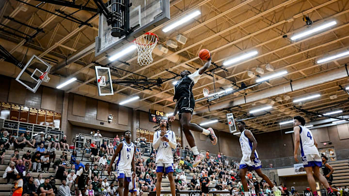 Team Motorcars and Michigan State's Coen Carr dunks against Case Credit Union during the Moneyball Pro-Am on Thursday, June 26, 2025, at Holt High School.