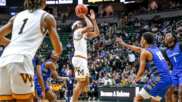 Wayne Memorial's Carlos Medlock Jr. shoots against Flint Carman-Ainsworth during the second quarter in the Division 1 state semifinal on Friday, March 14, 2025, at the Breslin Center in East Lansing. Wayne Memorial's Carlos Medlock Jr. shoots against Flint Carman-Ainsworth during the second quarter in the Division 1 state semifinal on Friday, March 14, 2025, at the Breslin Center in East Lansing.