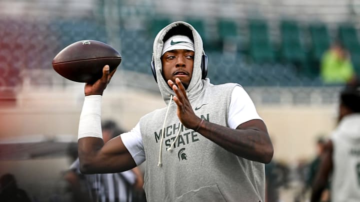 Michigan State's Aidan Chiles warms up before the football game against Western Michigan on Friday, Aug. 29, 2025, in East Lansing.