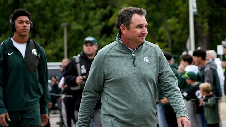 Michigan State's head coach Jonathan Smith walks past fans before the football game against Boston College on Saturday, Sept. 6, 2025, at Spartan Stadium in East Lansing.