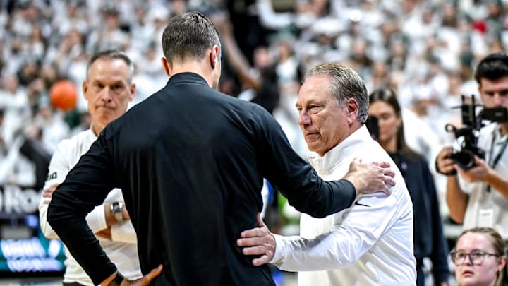 Michigan State's head coach Tom Izzo, right, meets with Duke's head coach Jon Scheyer before the game on Saturday, Dec. 6, 2025, at the Breslin Center in East Lansing.
