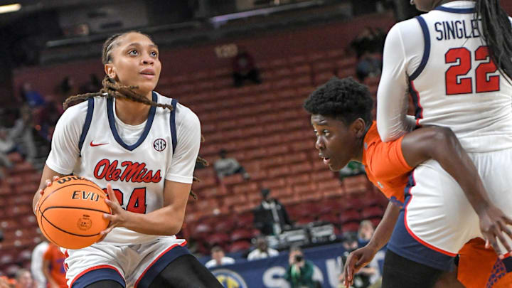Ole Miss Madison Scott (24) gets ready to shoot a ball near Florida forward Alexia Dizeko (9) and teammate Tyra Singleton (22) during the third quarter of the SEC Women's Basketball Tournament game at the Bon Secours Wellness Arena in Greenville, S.C. Friday, March 8, 2024.