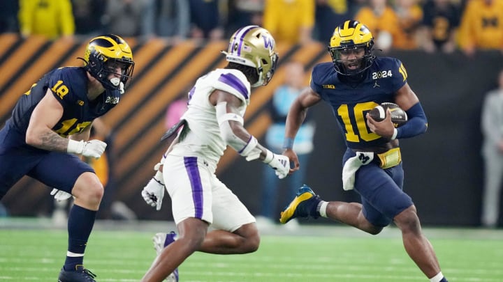 Michigan quarterback Alex Orji runs the ball in the second quarter of the College Football Playoff national championship game against Washington at NRG Stadium in Houston, Texas on Monday, Jan. 8, 2024.