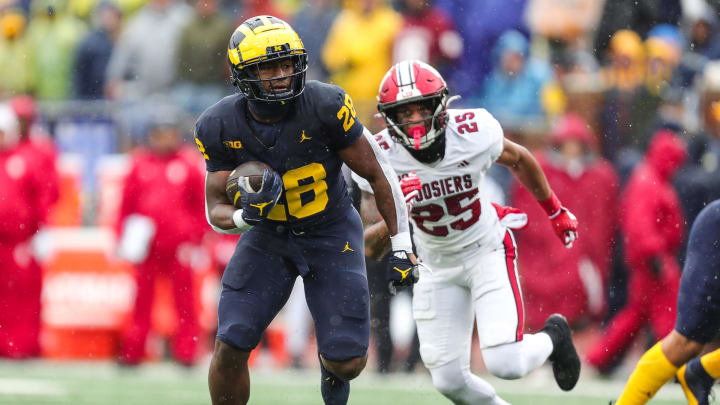 Michigan running back Benjamin Hall runs against Indiana defensive back Amare Ferrell during the second half of U-M's 52-7 win over Indiana on Saturday, Oct. 14, 2023, in Ann Arbor. Michigan running back Benjamin Hall runs against Indiana defensive back Amare Ferrell during the second half of U-M's 52-7 win over Indiana on Saturday, Oct. 14, 2023, in Ann Arbor.