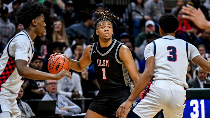 Orchard Lake St. Mary's Trey McKenney looks to pass against East Lansing during the third quarter in the Division 1 state semifinal on Friday, March 14, 2025, at the Breslin Center in East Lansing.