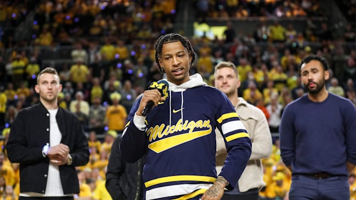 Trey Burke speaks during halftime as Michigan honors the 10-year anniversary of the 2013 run to the Final Four and national title game 
