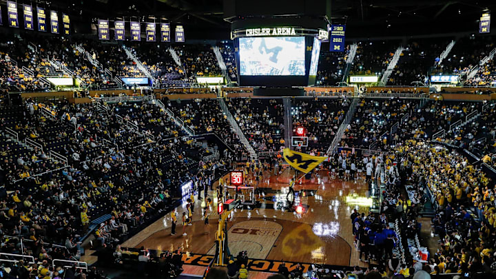 Michigan fans cheer on during players introduction before the Buffalo game at the Crisler Center in Ann Arbor on Wednesday, Nov. 10, 2021. Michigan fans cheer on during players introduction before the Buffalo game at the Crisler Center in Ann Arbor on Wednesday, Nov. 10, 2021.