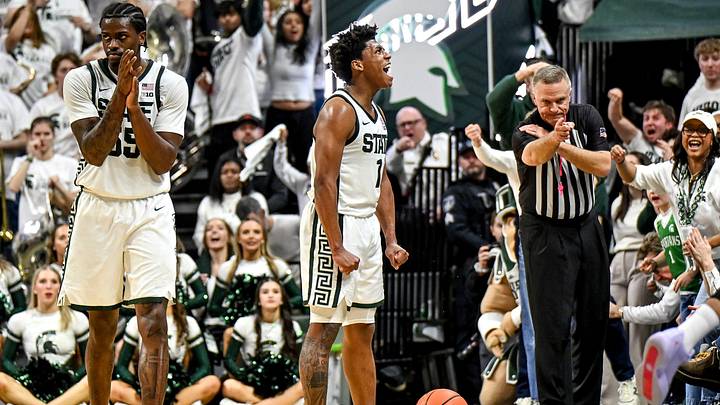 Michigan State's Jeremy Fears Jr., center, and Coen Carr, left, celebrate a Michigan turnover during the second half on Friday, Jan. 30, 2026, at the Breslin Center in East Lansing.