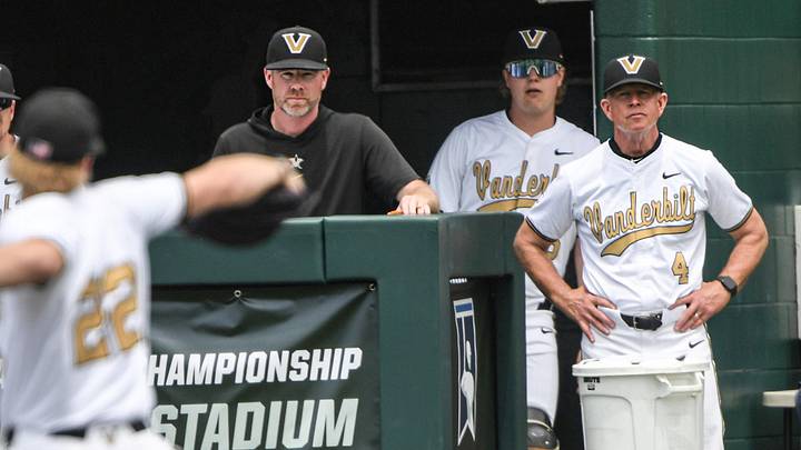 May 31, 2024; Clemson, SC, USA; Vanderbilt University Head Coach Tim Corbin, right, and pitching coach Scott Brown watch sophomore JD Thompson (22) pitch to Coastal Carolina University during the NCAA Clemson Regional baseball game at Doug Kingsmore Stadium. Mandatory Credit: Ken Ruinard-Imagn Images