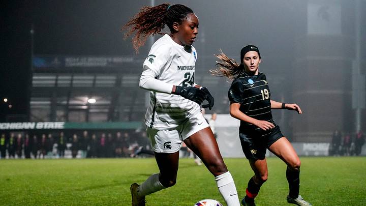 Michigan State's Kennedy Bell, left, moves the ball as Wake Forest's Sierra Sythe closes in during the first half on Thursday, Nov. 20, 2025, in the second round of the NCAA women's soccer tournament at DeMartin Stadium in East Lansing.