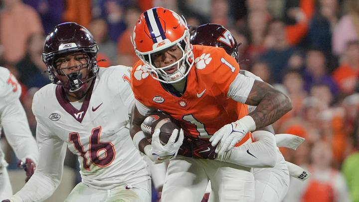 Clemson wide receiver T.J. Moore (1) runs after a catch near Virginia Tech Hokies linebacker Noah Chambers (16) during the third quarter at Memorial Stadium Saturday, October 24, 2026.