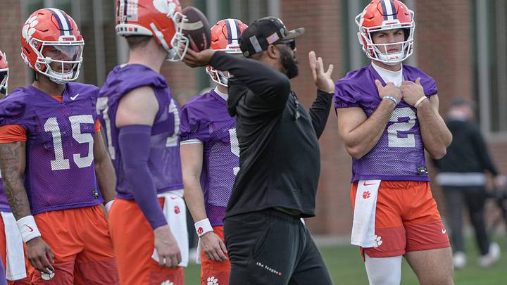 Clemson quarterback coach Tajh Boyd passes a ball with quarterbacks during the first Spring football practice open to media in Clemson, SC Friday, Feb 27, 2026.