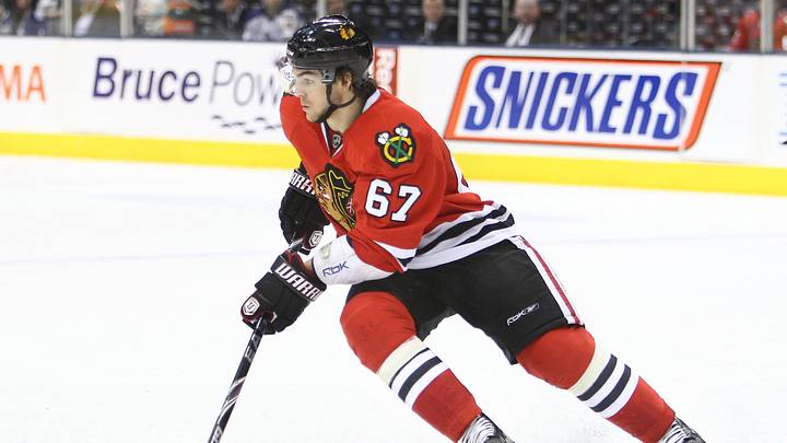 Mar 5, 2011; Toronto, ON, Canada; Chicago Blackhawks left wing Michael Frolik (67) controls the puck against the Toronto Maple Leafs at the Air Canada Centre. The Blackhawks beat the Maple Leafs 5-3. Mandatory Credit: Tom Szczerbowski-USA TODAY Sports