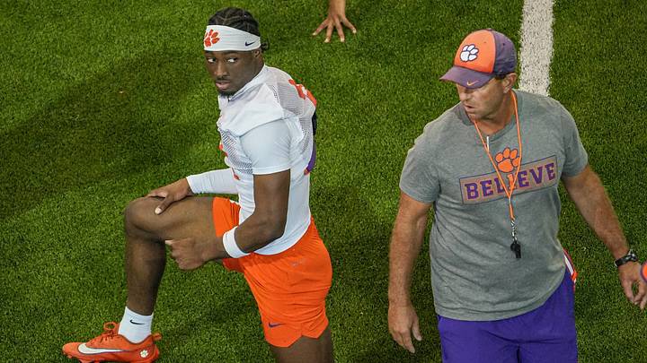 Clemson cornerback Ashton Hampton (2) looks as Clemson head coach Dabo Swinney walks by during practice during fall camp. Clemson cornerback Ashton Hampton (2) looks as Clemson head coach Dabo Swinney walks by during practice during fall camp.