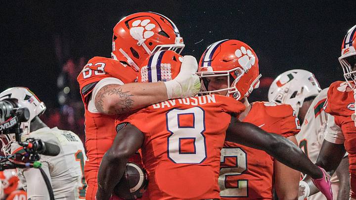 Clemson running back Gideon Davidson (8) celebrates his score with offensive lineman Easton Ware (63) and quarterback Tait Reynolds (2) in the game with Miami during the fourth quarter at Memorial Stadium Saturday, October 3, 2026. Clemson running back Gideon Davidson (8) celebrates his score with offensive lineman Easton Ware (63) and quarterback Tait Reynolds (2) in the game with Miami during the fourth quarter at Memorial Stadium Saturday, October 3, 2026.