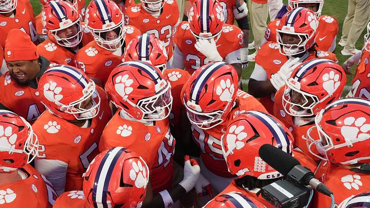 Clemson defensive lineman Vic Burley (45) and Clemson defensive lineman Amare Adams (95) among teammates during warm-up time before kickoff with Clemson and Virginia Tech at Memorial Stadium in Clemson, S.C. Saturday, Oct 24, 2026. Clemson defensive lineman Vic Burley (45) and Clemson defensive lineman Amare Adams (95) among teammates during warm-up time before kickoff with Clemson and Virginia Tech at Memorial Stadium in Clemson, S.C. Saturday, Oct 24, 2026.