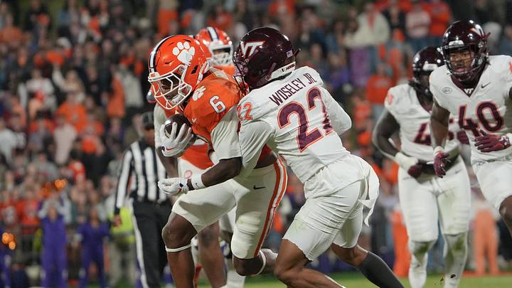 Clemson receiver Tyler Brown (6) is tackled by Virginia Tech cornerback Kenny Woseley, Jr. (22) during the third quarter at Memorial Stadium on Saturday, October 24, 2026. Clemson receiver Tyler Brown (6) is tackled by Virginia Tech cornerback Kenny Woseley, Jr. (22) during the third quarter at Memorial Stadium on Saturday, October 24, 2026.