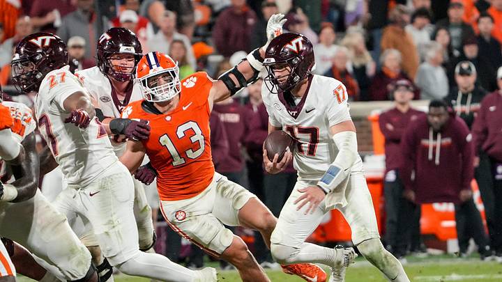 Clemson defensive end Will Heldt (13) pressures Virginia Tech Hokies quarterback Ethan Grunkemeyer (17) during the fourth quarter at Memorial Stadium Saturday, October 24, 2026. Clemson defensive end Will Heldt (13) pressures Virginia Tech Hokies quarterback Ethan Grunkemeyer (17) during the fourth quarter at Memorial Stadium Saturday, October 24, 2026.