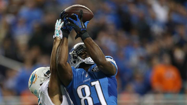 Detroit Lions Calvin Johnson catches a touchdown against the Miami Dolphins Brent Grimes during first-half action on November 9, 2014, at Ford Field in Detroit. Detroit Lions Calvin Johnson catches a touchdown against the Miami Dolphins Brent Grimes during first-half action on November 9, 2014, at Ford Field in Detroit.