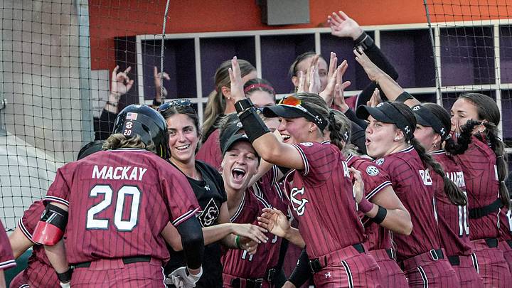 South Carolina senior Jamie Mackay (20) is congratulated by teammates after her solo home run during the top of the seventh inning at McWhorter Stadium in Clemson Tuesday, April 14, 2025. South Carolina senior Jamie Mackay (20) is congratulated by teammates after her solo home run during the top of the seventh inning at McWhorter Stadium in Clemson Tuesday, April 14, 2025.