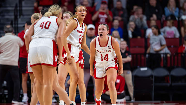 Nebraska basketball guard Callin Hake (14) celebrates with forward Alexis Markowski (40) against Southeastern Louisiana.