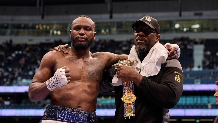Viddal Riley with his father, Derrick Riley.