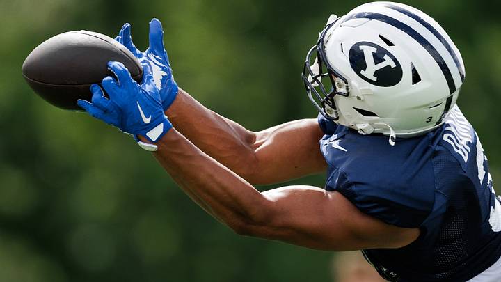 BYU safety Raider Damuni intercepts a pass at Fall Camp BYU safety Raider Damuni intercepts a pass at Fall Camp