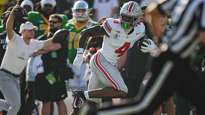 Ohio State freshman wide receiver Jeremiah Smith runs with the ball against Oregon in the Rose Bowl.