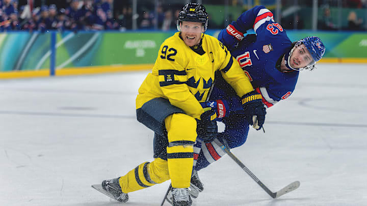 Quinn Hughes (right) scored the game-winning goal in overtime for a 2–1 win over Sweden. 