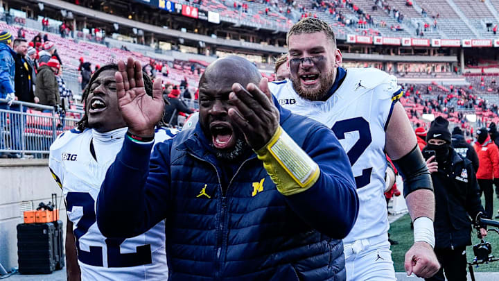 Michigan running backs coach Tony Alford celebrate 13-10 win over Ohio State as he exits the field at Ohio Stadium in Columbus, Ohio on Saturday, Nov. 30, 2024.
