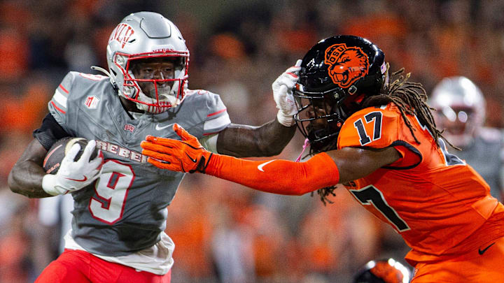 UNLV Rebels running back Jai'Den Thomas (9) stiff arms Oregon State Beavers defensive back Skyler Thomas (17) during an NCAA football game against UNLV at Reser Stadium on Saturday, Oct. 19, 2024, in Corvallis, Ore.