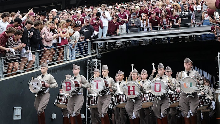 Dec 20, 2025; College Station, TX, USA; The  Texas A&M Aggies band takes the field prior to the game against the Miami Hurricanes during the first round of the CFP National Playoff at Kyle Field. Mandatory Credit: Maria Lysaker-Imagn Images