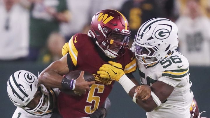 Green Bay Packers defenders Micah Parsons and Edgerrin Cooper sack Washington Commanders quarterback Jayden Daniels