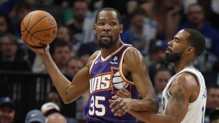 Apr 14, 2024; Minneapolis, Minnesota, USA; Phoenix Suns forward Kevin Durant (35) looks to pass as