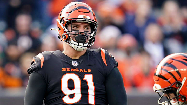 Cincinnati Bengals defensive end Trey Hendrickson (91), left, and Cincinnati Bengals defensive end Sam Hubbard (94) celebrate a sack in the second quarter during a Week 16 NFL game against the Baltimore Ravens, Sunday, Dec. 26, 2021, at Paul Brown Stadium in Cincinnati.