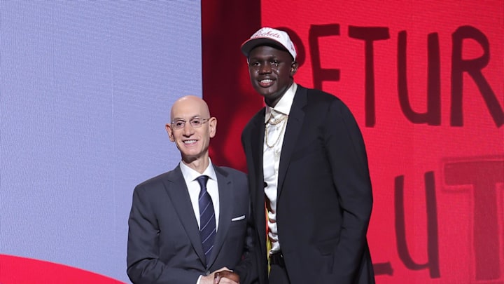 Khaman Maluach stands with NBA commissioner Adam Silver after being selected as the tenth pick by the Houston Rockets.
