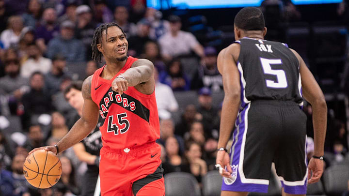 Nov 6, 2024; Sacramento, California, USA; Toronto Raptors guard Davion Mitchell (45) directs the offense during the third quarter against the Sacramento Kings at Golden 1 Center. Mandatory Credit: Ed Szczepanski-Imagn Images
