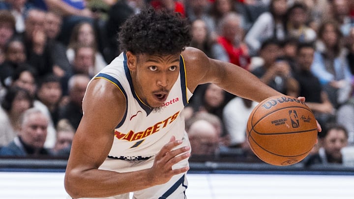 Oct 6, 2025; Vancouver, British Columbia, CAN; Denver Nuggets guard Curtis Jones (1) handles the ball against the Toronto Raptors in the second half at Rogers Arena. Oct 6, 2025; Vancouver, British Columbia, CAN; Denver Nuggets guard Curtis Jones (1) handles the ball against the Toronto Raptors in the second half at Rogers Arena.