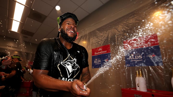 Oct 8, 2025; Bronx, New York, USA; Toronto Blue Jays first baseman Vladimir Guerrero Jr. (27)celebrates in the locker room after defeating the New York Yankees in game four of the ALDS round of the 2025 MLB playoffs at Yankee Stadium. Mandatory Credit: Brad Penner-Imagn Images