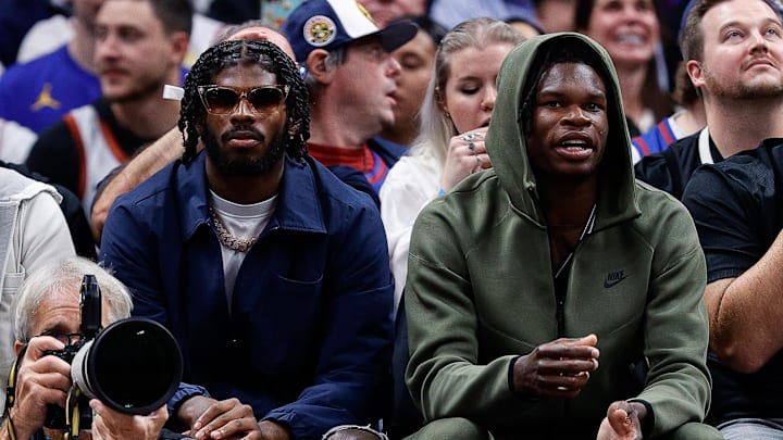 Oct 24, 2023; Denver, Colorado, USA; University of Colorado Buffaloes football players Shedeur Sanders (L) and Travis Hunter (R) watch during the third period between the Denver Nuggets and the Los Angeles Lakers at Ball Arena. Mandatory Credit: Isaiah J. Downing-Imagn Images