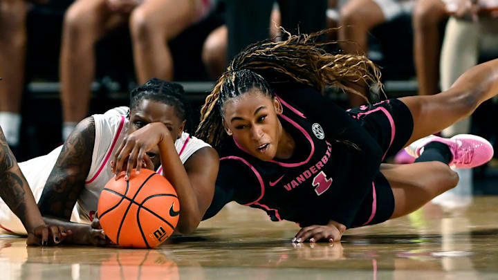 Vanderbilt’s Mikayla Blakes (1) and Mississippi State forward Quanirah Montague, left, scramble for the ball in double overtime during an NCAA college basketball game Thursday, Feb. 13, 2025, in Nashville, Tenn.