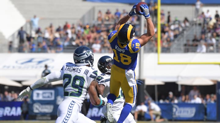 Oct 8, 2017; Los Angeles, CA, USA; Los Angeles Rams wide receiver Cooper Kupp (18) catches a pass in the first quarter as Seattle Seahawks free safety Earl Thomas (29) and cornerback Justin Coleman (28) defend during a NFL football game at Los Angeles Memorial Coliseum. Oct 8, 2017; Los Angeles, CA, USA; Los Angeles Rams wide receiver Cooper Kupp (18) catches a pass in the first quarter as Seattle Seahawks free safety Earl Thomas (29) and cornerback Justin Coleman (28) defend during a NFL football game at Los Angeles Memorial Coliseum.